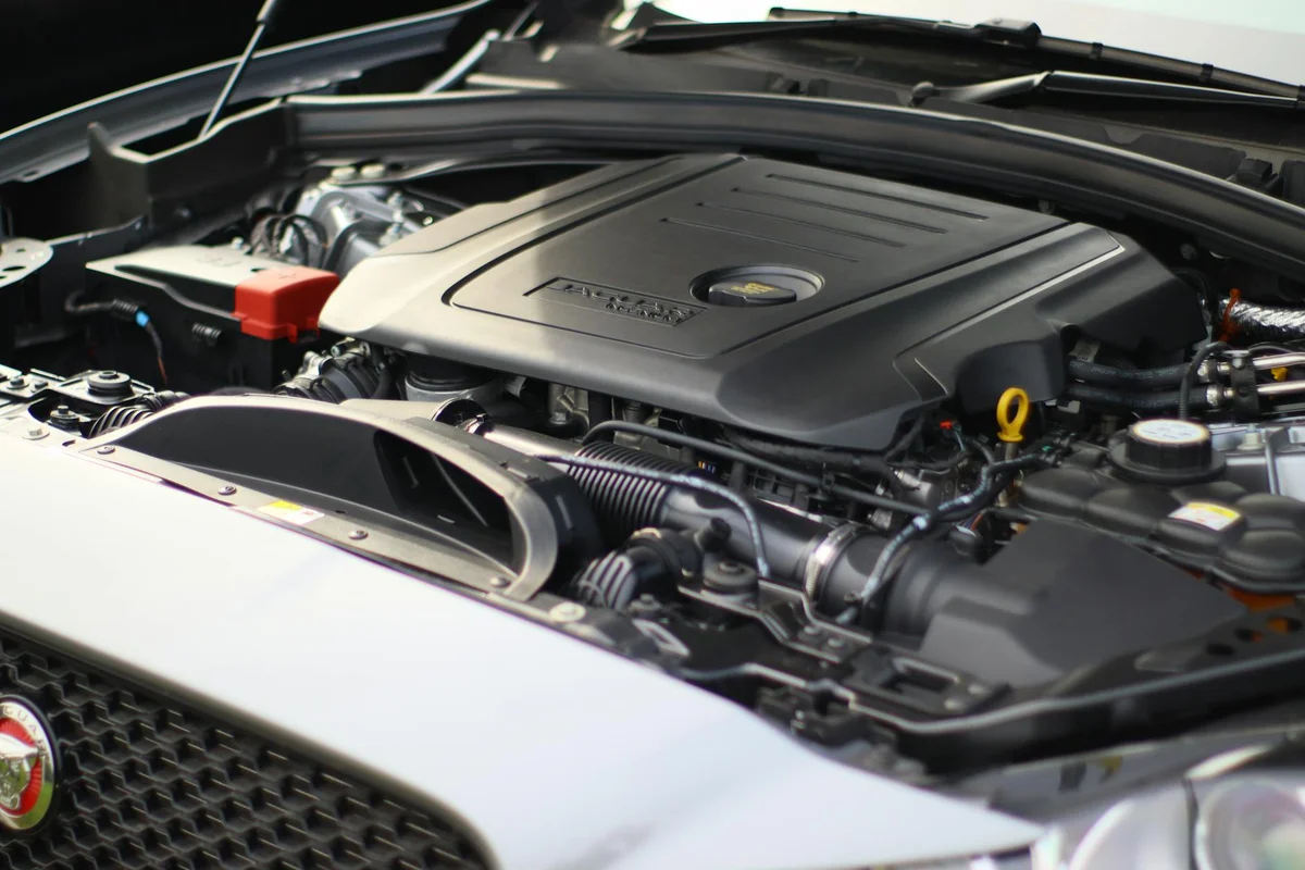 Close-up view of an electric vehicle charging with a focus on the connector and charging port.