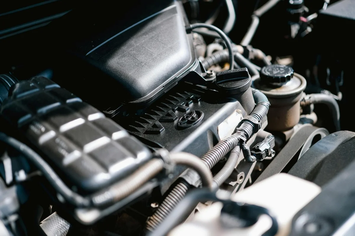 Close-up of an electric car being charged, highlighting eco-friendly transportation.