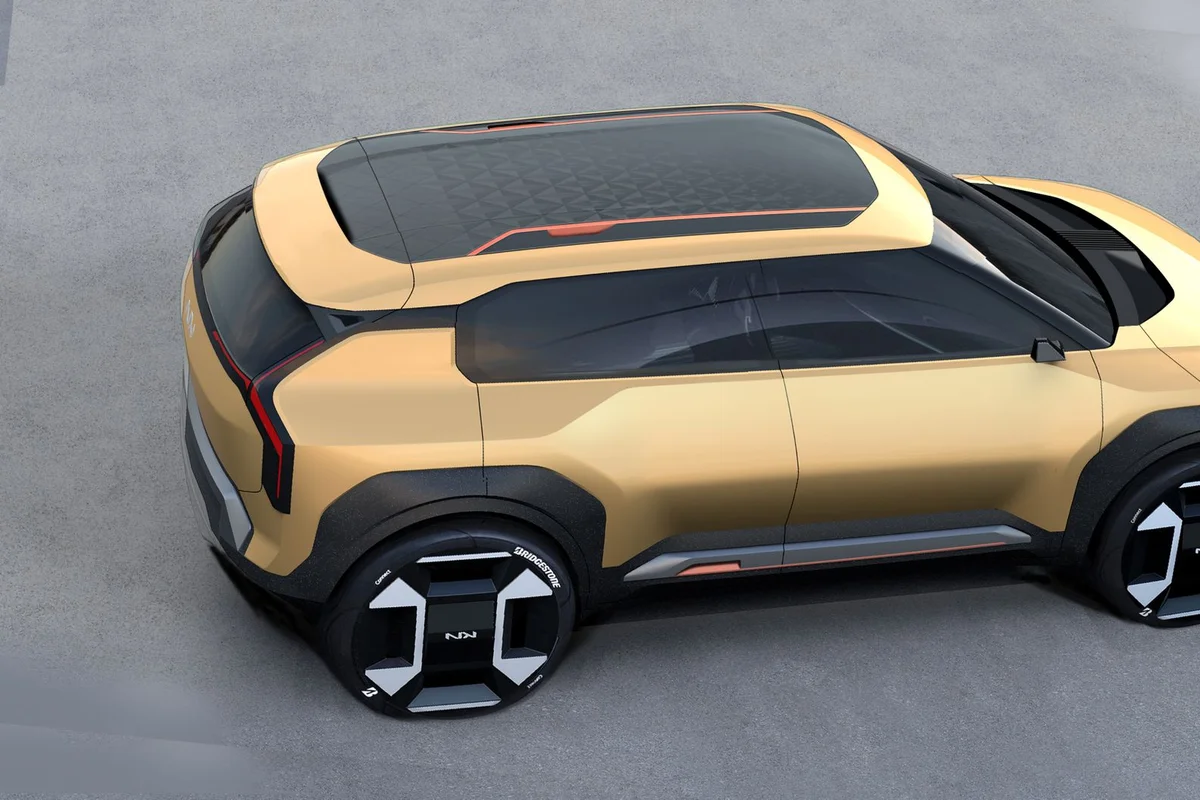 Futuristic gold concept car design showcasing modern electric vehicle features.