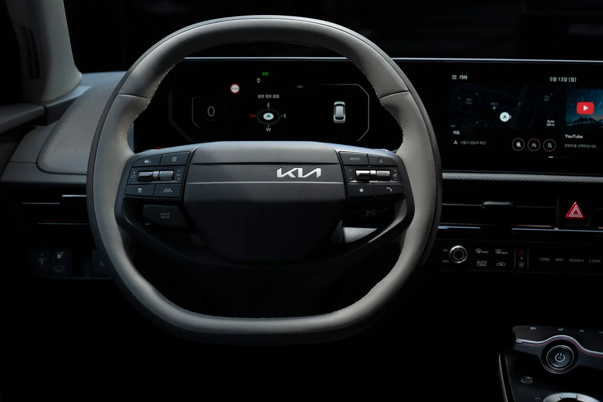 Close-up view of the Kia EV's steering wheel showcasing its modern design and technology.