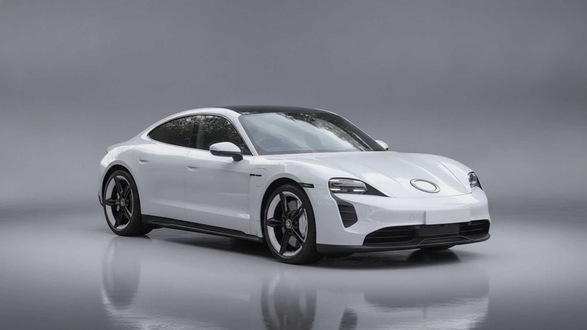 A white Porsche Taycan with a black roof is parked on a reflective gray surface.