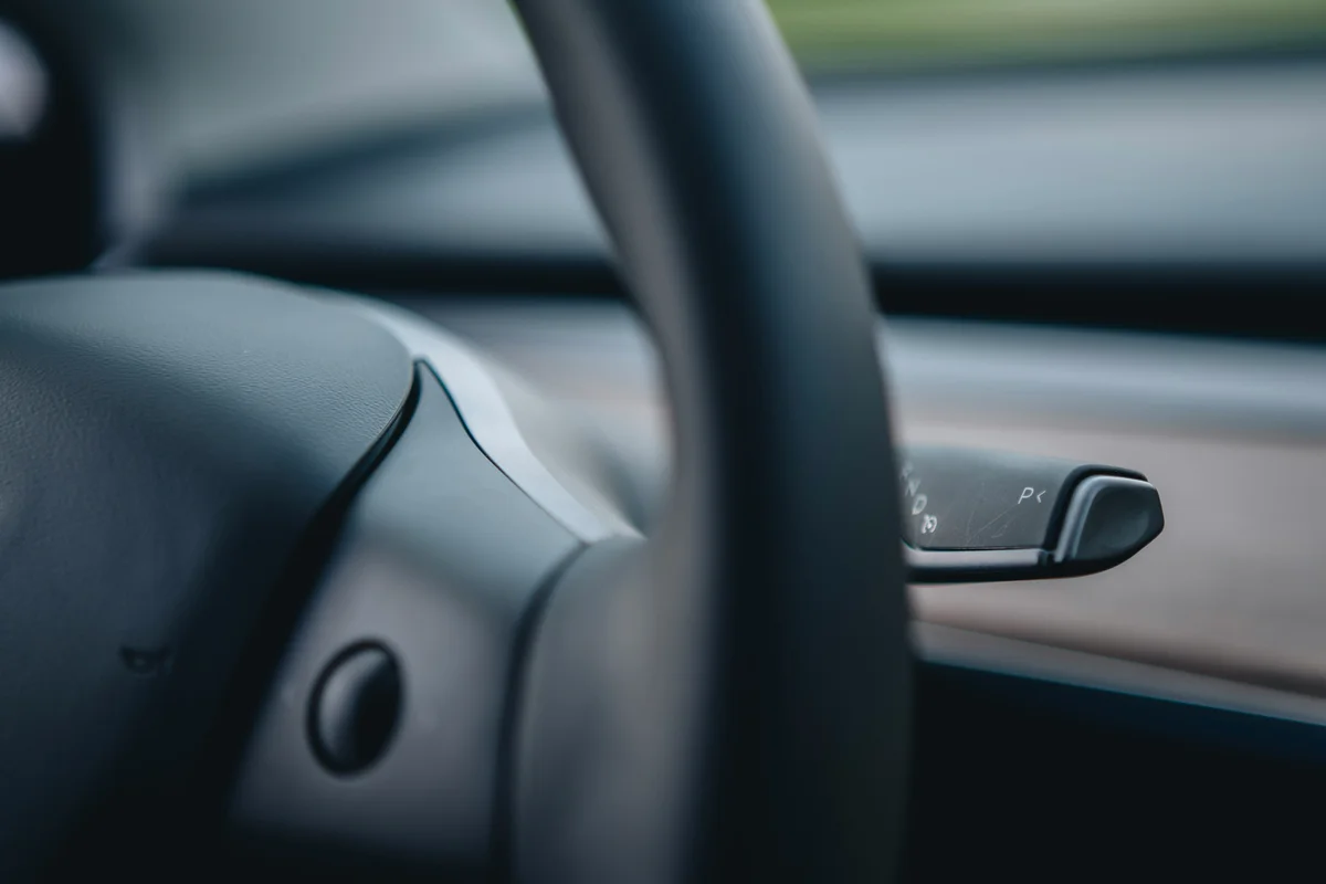 a close up of a steering wheel of a car