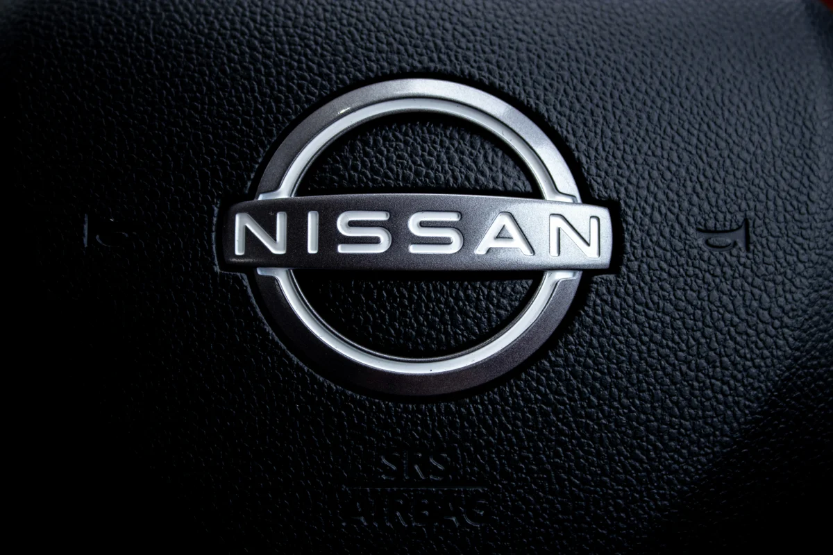 Close-up of a nissan car steering wheel logo