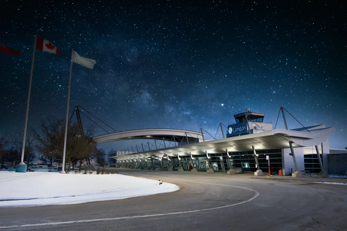 Modern building entrance under a starry night sky